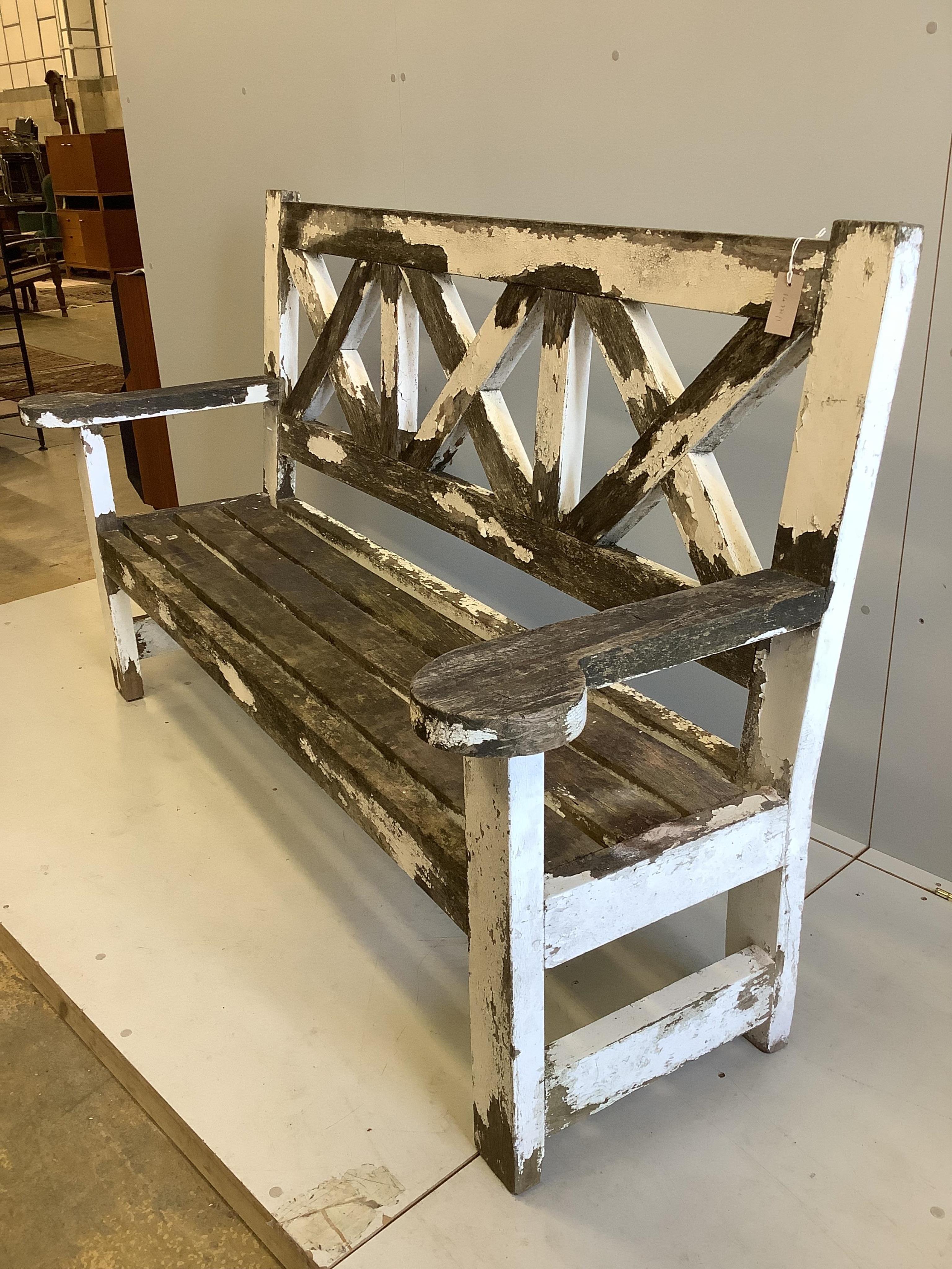 A 'country house' weathered teak garden bench, width 193cm, depth 60cm, height 110cm. Condition - fair